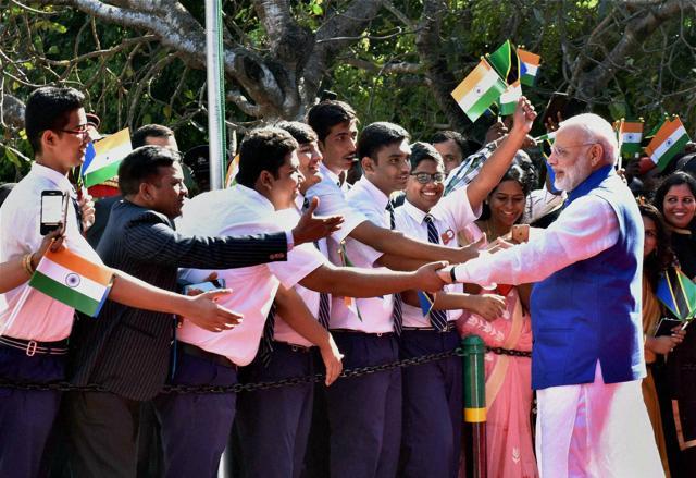 Prime Minister Narendra Modi being greeted by members of the Indian community in Dar-es-Salaam, Tanzania. (PTI Photo) Prime Minister Narendra Modi being greeted by members of the Indian community in Dar-es-Salaam, Tanzania. (PTI Photo)