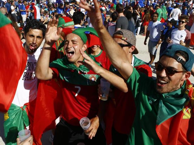 Portuguese supporters chant at the Paris fan zone, hours before the Euro 2016 final. (AP Photo)