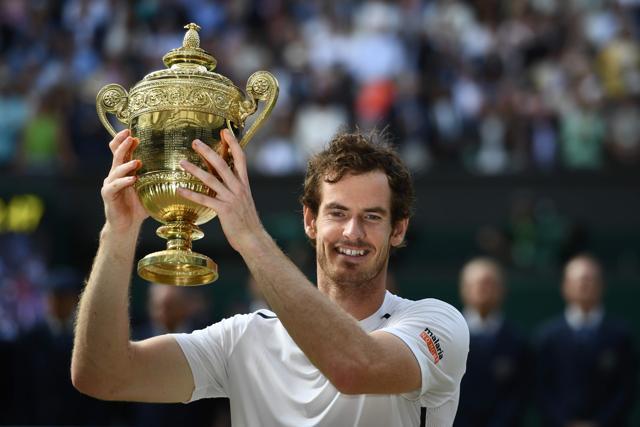 Britain's Andy Murray poses with the winner's trophy after his men's singles final victory. (AFP Photo) Britain's Andy Murray poses with the winner's trophy after his men's singles final victory. (AFP Photo)