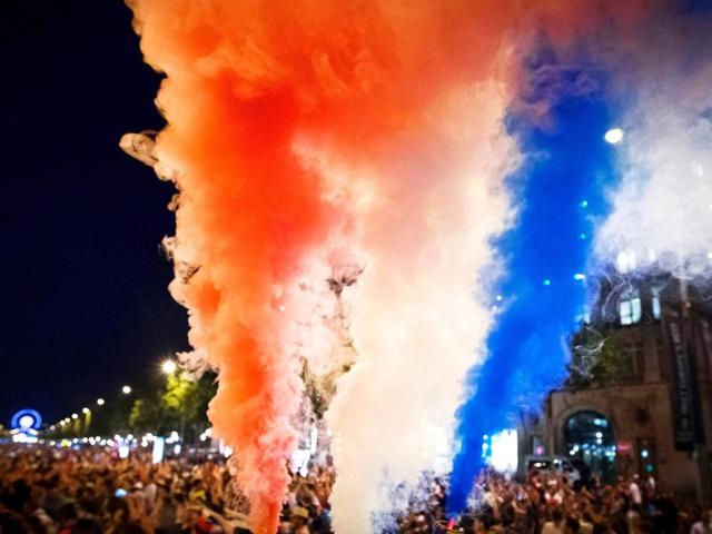 France supporters celebrate with smoke flares after France won the Euro 2016 semi-final football match. (AFP Photo) France supporters celebrate with smoke flares after France won the Euro 2016 semi-final football match. (AFP Photo)