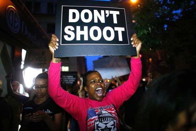 A woman holds a banner during a protest in support of the Black Lives Matter movement in New York. (AFP) A woman holds a banner during a protest in support of the Black Lives Matter movement in New York. (AFP)