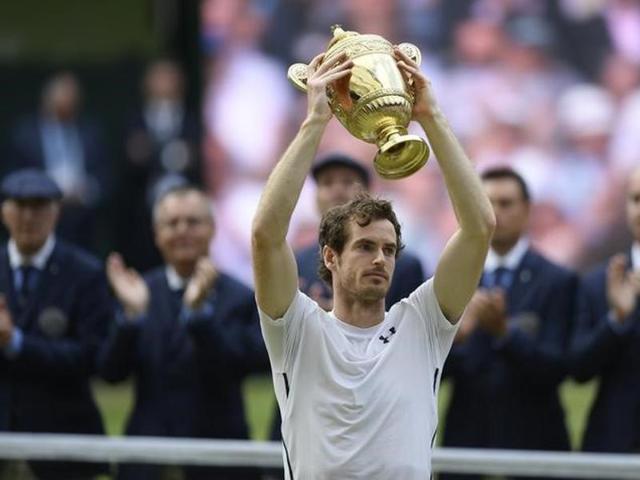 Great Britain's Andy Murray celebrates with the trophy after winning the gentlemen’s singles final against Canada's Milos Raonic at Wimbledon on July 10, 2016. Murray won his second Wimbledon title and third straight Grand Slam. (Reuters)