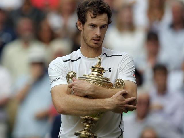 Andy Murray of Britain holds up his trophy after beating Milos Raonic of Canada in the men's singles final on day fourteen of the Wimbledon Tennis Championships in London. (AP Photo) Andy Murray of Britain holds up his trophy after beating Milos Raonic of Canada in the men's singles final on day fourteen of the Wimbledon Tennis Championships in London. (AP Photo)