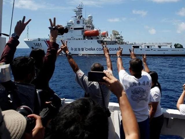 A Chinese Coast Guard vessel manoeuvres to block a Philippine government supply ship with members of the media aboard at the disputed Second Thomas Shoal, part of the Spratly Islands, in the South China Sea in (Reuters file photo) A Chinese Coast Guard vessel manoeuvres to block a Philippine government supply ship with members of the media aboard at the disputed Second Thomas Shoal, part of the Spratly Islands, in the South China Sea in (Reuters file photo)