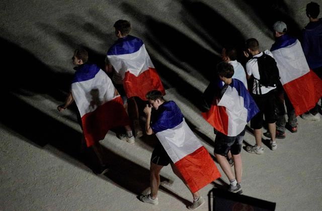 France supporters walk during the Euro 2016 final match between Portugal and France. (AFP PHOTO) France supporters walk during the Euro 2016 final match between Portugal and France. (AFP PHOTO)