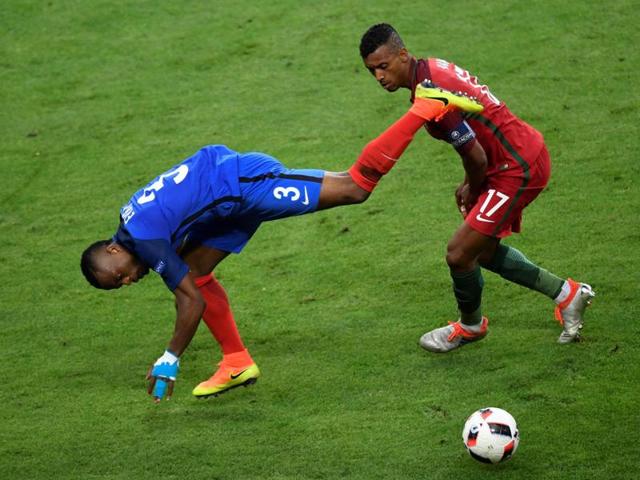 France's defender Patrice Evra (L) and Portugal's forward Nani vie for the ball during the Euro 2016 final. (AFP Photo) France's defender Patrice Evra (L) and Portugal's forward Nani vie for the ball during the Euro 2016 final. (AFP Photo)