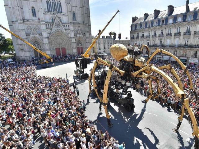 Kumo, a mechanical spider made of wood and steel is presented to the public for the first time in front of the Nantes Cathedral, western France. (AFP) Kumo, a mechanical spider made of wood and steel is presented to the public for the first time in front of the Nantes Cathedral, western France. (AFP)
