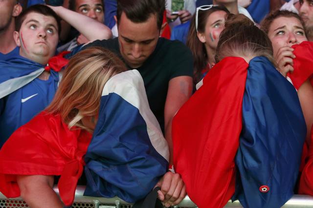 France fans react at the fan zone after their team lost to Portugal with heartfelt tears and plenty jeers. (REUTERS PHOTO) France fans react at the fan zone after their team lost to Portugal with heartfelt tears and plenty jeers. (REUTERS PHOTO)