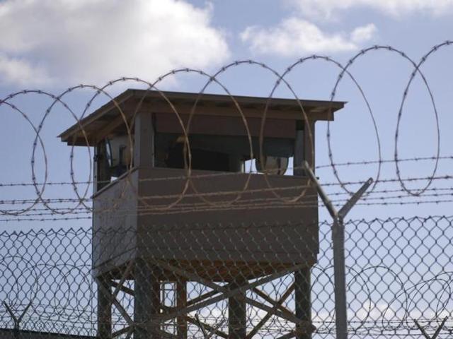A soldier stands guard in a tower overlooking Camp Delta at Guantanamo Bay naval base. (Reuters Photo) A soldier stands guard in a tower overlooking Camp Delta at Guantanamo Bay naval base. (Reuters Photo)