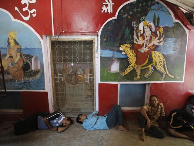 Devotees on the annual pilgrimage to Amarnath caves, rest inside a temple in Srinagar. The pilgrimage was suspended as clashes between protesters and security forces escalated in the valley after troops killed Burhan Wani. (AP) Devotees on the annual pilgrimage to Amarnath caves, rest inside a temple in Srinagar. The pilgrimage was suspended as clashes between protesters and security forces escalated in the valley after troops killed Burhan Wani. (AP)