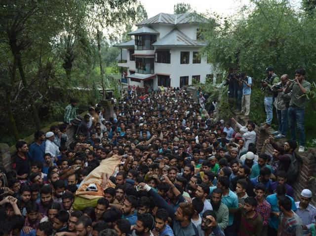 Mourners carry the body of Burhan Wani in Kashmir, ahead of his funeral in Tral, his native town, 42kms south of Srinagar. A top leader of Hizbul Mujahideen, Kashmir’s largest militant group, was killed in a gun battle with security forces on July 8. (AFP) Mourners carry the body of Burhan Wani in Kashmir, ahead of his funeral in Tral, his native town, 42kms south of Srinagar. A top leader of Hizbul Mujahideen, Kashmir’s largest militant group, was killed in a gun battle with security forces on July 8. (AFP)