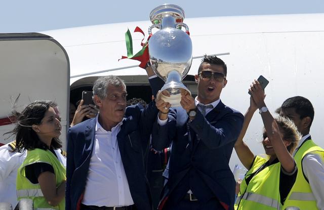 Portugal's Cristiano Ronaldo and coach Fernando Santos, left, lift the Euro 2016 trophy. (AP Photo) Portugal's Cristiano Ronaldo and coach Fernando Santos, left, lift the Euro 2016 trophy. (AP Photo)