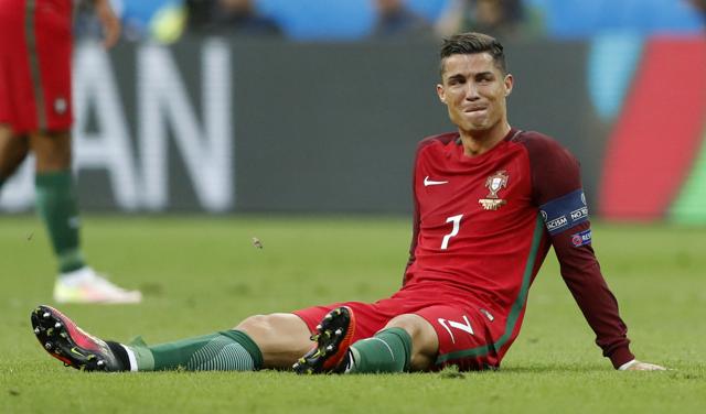 Portugal's Cristiano Ronaldo reacts after sustaining an injury. (REUTERS) Portugal's Cristiano Ronaldo reacts after sustaining an injury. (REUTERS)