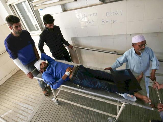 People carry an injured for treatment to a local hospital in Srinagar, India on July 10, 2016. At least 22 people have died in clashes between protesters and security forces in Kashmir in three days after Hizb militant Burhan Wani was killed in an encounter. (Waseem Andrabi / HT Photo) People carry an injured for treatment to a local hospital in Srinagar, India on July 10, 2016. At least 22 people have died in clashes between protesters and security forces in Kashmir in three days after Hizb militant Burhan Wani was killed in an encounter. (Waseem Andrabi / HT Photo)
