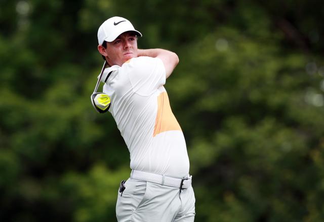 Rory Mcllroy tees off during the first round of The Memorial Tournament.(AFP Photo)