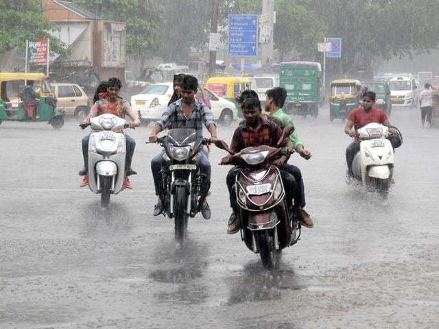 People ride bikes as monsoon rain lashes New Delhi. (HT File Photo) People ride bikes as monsoon rain lashes New Delhi. (HT File Photo)