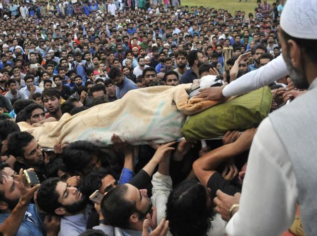 Kashmiris carry the body of Hizb militant Burhan Wani during funeral procession in his hometown in Tral on Saturday 09 July 2016.(Waseem Andrab / HT Photo) Kashmiris carry the body of Hizb militant Burhan Wani during funeral procession in his hometown in Tral on Saturday 09 July 2016.(Waseem Andrab / HT Photo)