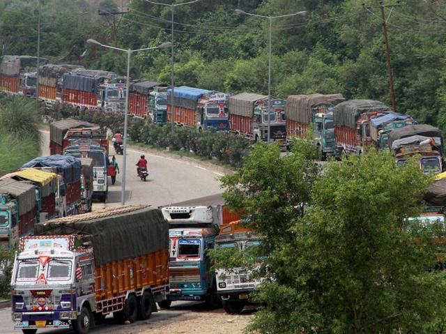 Stranded trucks on the Jammu-Srinagar National Highway which was closed after protesters clashed with security forces in Kashmir. (PTI) Stranded trucks on the Jammu-Srinagar National Highway which was closed after protesters clashed with security forces in Kashmir. (PTI)