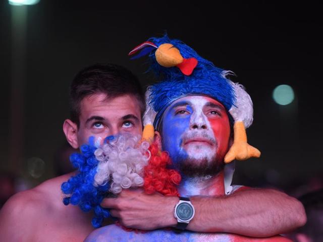French supporters react following the Euro 2016 final football match between Portugal and France at the Marseille Fan Zone. (AFP Photo) French supporters react following the Euro 2016 final football match between Portugal and France at the Marseille Fan Zone. (AFP Photo)
