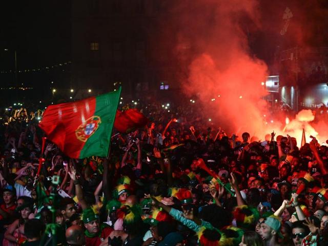 Portugal's national football team supporters celebrate their team's victory at Terreiro do Paco square in Lisbon. (AFP Photo) Portugal's national football team supporters celebrate their team's victory at Terreiro do Paco square in Lisbon. (AFP Photo)