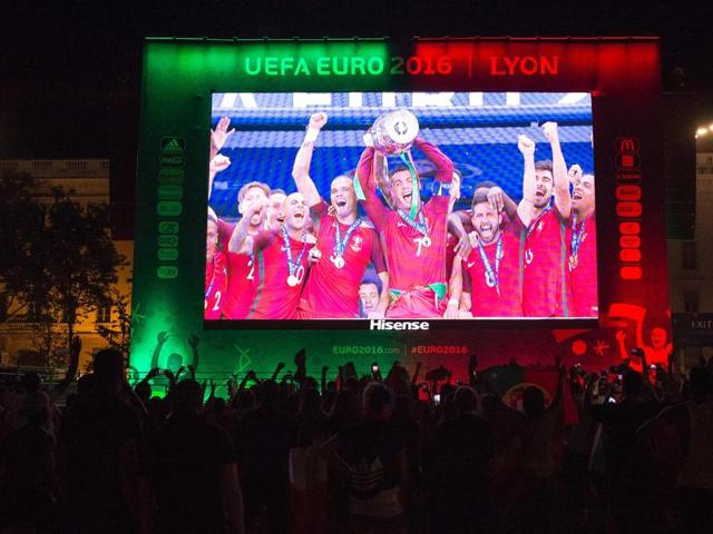 Portugal's supporters celebrate at the Lyon fanzone following the Euro 2016 football tournament final match between Portugal and France. (AFP Photo) Portugal's supporters celebrate at the Lyon fanzone following the Euro 2016 football tournament final match between Portugal and France. (AFP Photo)