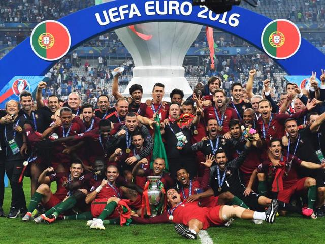 Portugal's players pose with the trophy after they beat France during the Euro 2016 final football match at the Stade de France in Saint-Denis, north of Paris. (AFP Photo) Portugal's players pose with the trophy after they beat France during the Euro 2016 final football match at the Stade de France in Saint-Denis, north of Paris. (AFP Photo)