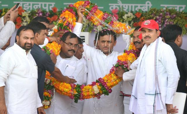 Uttar Pradesh chief minister Akhilesh Yadav is garlanded by Samajwadi Party workers during a public rally to launch various schemes at Manjhanpur in Kaushambi district. (PTI file photo)
