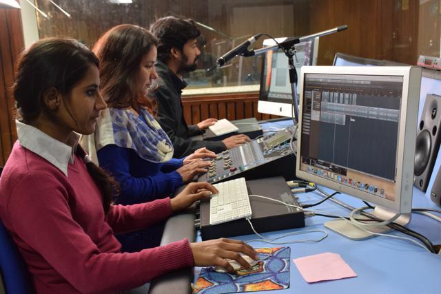 Students at Radio Jamia with assistant engineer Saba Parveen (middle). (Radio Jamia)