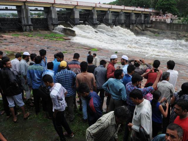 Three sluice gates of Bhadbhada Dam were opened on Tuesday after the lake almost reached its full tank level. (Praveen Bajpai/HT photo) Three sluice gates of Bhadbhada Dam were opened on Tuesday after the lake almost reached its full tank level. (Praveen Bajpai/HT photo)