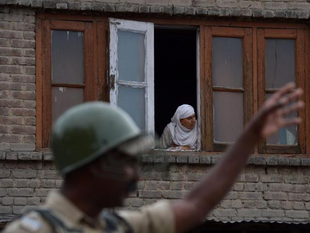 A Kashmiri Muslim woman looks out from a window of a home during a curfew in Srinagar. (AFP Photo) A Kashmiri Muslim woman looks out from a window of a home during a curfew in Srinagar. (AFP Photo)