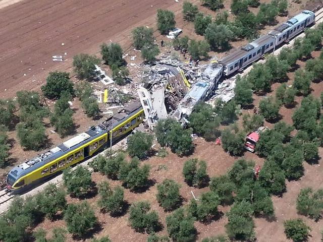 This handout picture released by the Italian firefighters Vigili del Fuoco press office shows two smashed carriages thrown across the tracks, in the southern Italian region of Puglia. (AFP Photo) This handout picture released by the Italian firefighters Vigili del Fuoco press office shows two smashed carriages thrown across the tracks, in the southern Italian region of Puglia. (AFP Photo)