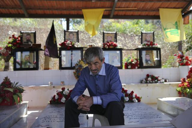 Afif Jawad, 63, who lost eight members of his family including his, parents, sister, wife and four children, on July 24, 2006 when an air raid struck his home during the 2006 war, speaks during an interview with The Associated Press next to his family's graves at a cemetery in the southern village of Harees, close to the town of Bint Jbail, Lebanon. (AP) Afif Jawad, 63, who lost eight members of his family including his, parents, sister, wife and four children, on July 24, 2006 when an air raid struck his home during the 2006 war, speaks during an interview with The Associated Press next to his family's graves at a cemetery in the southern village of Harees, close to the town of Bint Jbail, Lebanon. (AP)