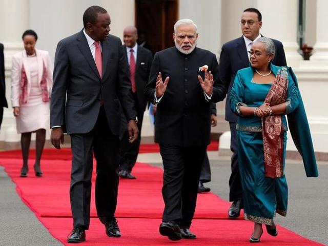 Narendra Modi walks with Kenyan President Uhuru Kenyatta and First Lady Margaret during the official welcoming ceremony at the State House in Nairobi, (Reuters) Narendra Modi walks with Kenyan President Uhuru Kenyatta and First Lady Margaret during the official welcoming ceremony at the State House in Nairobi, (Reuters)