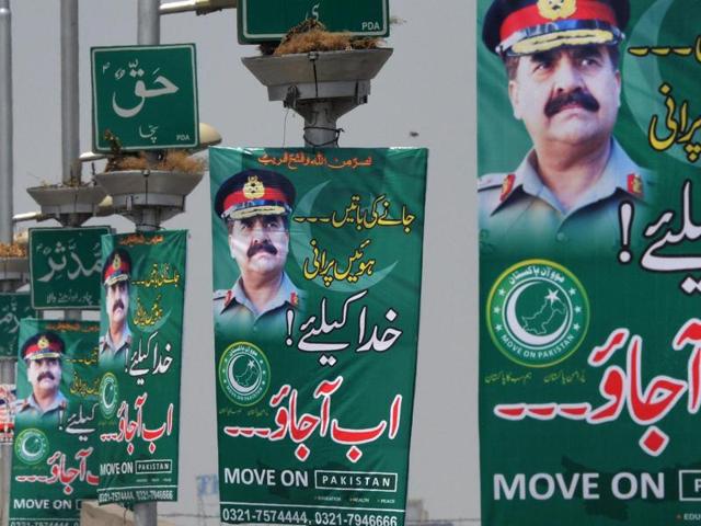 Pakistani commuters drive past posters of army chief Gen Raheel Sharif in Peshawar on Tuesday. Posters begging Pakistan's powerful army chief to launch a coup appeared in major cities, including the capital Islamabad, overnight, raising eyebrows in a country that has been ruled by the military for more than half its history. (AFP Photo) Pakistani commuters drive past posters of army chief Gen Raheel Sharif in Peshawar on Tuesday. Posters begging Pakistan's powerful army chief to launch a coup appeared in major cities, including the capital Islamabad, overnight, raising eyebrows in a country that has been ruled by the military for more than half its history. (AFP Photo)