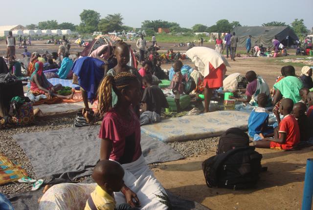 At least 3000 displaced women, men and children gather to seek shelter in Juba, South Sudan at the UN compound in Tomping area, Monday, July 11, 2016. (AP)