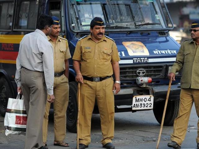 Policemen in Mumbai stand guard at a marketplace. India’s cops are called names, each region has its own.(Arijit Sen / HT Photo)