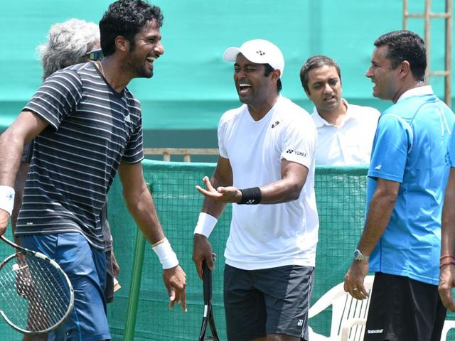 While Rohan Bopanna (right) and Leander Paes seemed to be gelling on court during practice on Wednesday. (Sanjeev Sharma/HT Photo) While Rohan Bopanna (right) and Leander Paes seemed to be gelling on court during practice on Wednesday. (Sanjeev Sharma/HT Photo)
