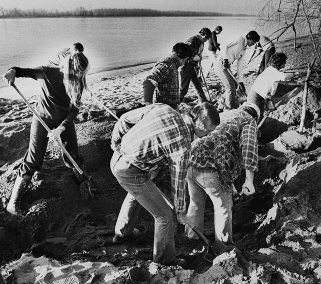 In this February 13, 1980, file photo, FBI agents scour the sand of a beach of the Columbia River, searching for additional money or clues in DB Cooper skyjacking case in Vancouver. (AP file photo)