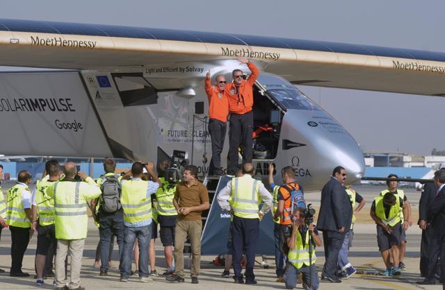 Swiss pilot Andre Borschberg (R) is welcomed by fellow pilot Bertrand Piccard after landing Solar Impulse 2, the solar powered plane, at Cairo International Airport on Wednesday, for the penultimate stage of its world tour. (AFP) Swiss pilot Andre Borschberg (R) is welcomed by fellow pilot Bertrand Piccard after landing Solar Impulse 2, the solar powered plane, at Cairo International Airport on Wednesday, for the penultimate stage of its world tour. (AFP)
