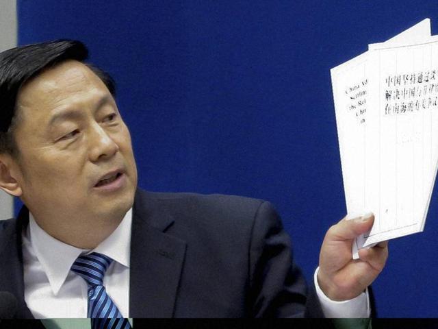 State Council Information Office spokesman, Guo Weimin, holds up white policy paper on South China Sea during a press briefing in Beijing. (AP Photo) State Council Information Office spokesman, Guo Weimin, holds up white policy paper on South China Sea during a press briefing in Beijing. (AP Photo)