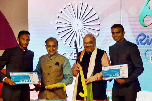 BJP president Amit Shah and sports minister Vijay Goel with captain of Indian men's hockey team PR Sreejesh (right) and vice-captain SV Sunil after the announcement of men's hockey squad for the upcoming Rio Olympics, in New Delhi on Tuesday. (PTI) BJP president Amit Shah and sports minister Vijay Goel with captain of Indian men's hockey team PR Sreejesh (right) and vice-captain SV Sunil after the announcement of men's hockey squad for the upcoming Rio Olympics, in New Delhi on Tuesday. (PTI)