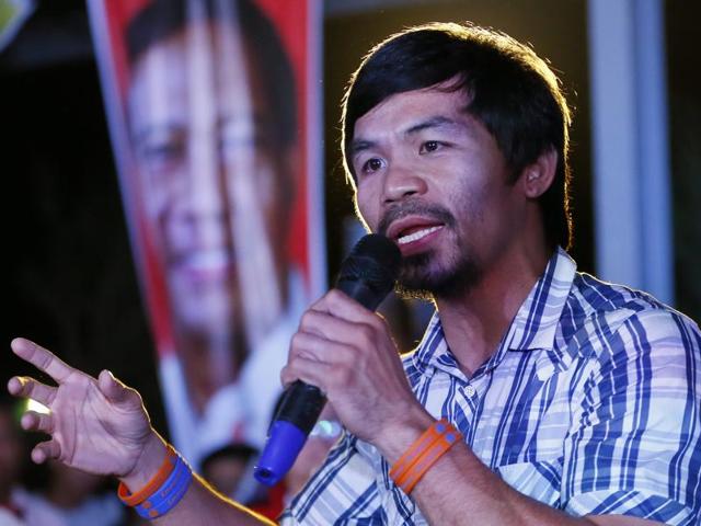 A file photo of Manny Pacquiao (R) and Timothy Bradley Jr. facing off during their fight. (AFP Photo) A file photo of Manny Pacquiao (R) and Timothy Bradley Jr. facing off during their fight. (AFP Photo)