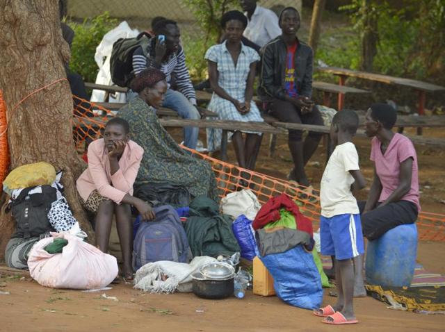 People take shelter near the All Saints Church in Juba, South Sudan. Embassies and aid organisations in South Sudan were trying to evacuate staff from the capital, Juba, on Tuesday as a precarious calm settled over the city following several days of deadly clashes.(AP Photo) People take shelter near the All Saints Church in Juba, South Sudan. Embassies and aid organisations in South Sudan were trying to evacuate staff from the capital, Juba, on Tuesday as a precarious calm settled over the city following several days of deadly clashes.(AP Photo)