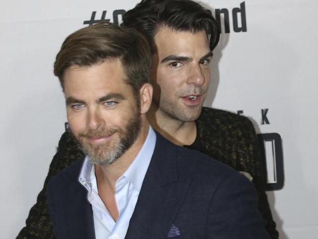 BFFs forever: Chris Pine and Zachary Quinto pass each other as they walk the red carpet during the premier of Star Trek Beyond in Sydney, Australia. (AP) 