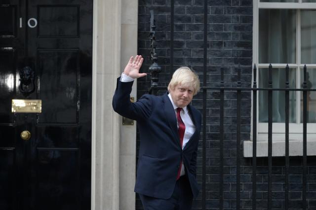 Newly appointed Foreign Secretary Boris Johnson waves as he leaves 10 Downing Street in central London on July 13, 2016 after new British Prime Minister Theresa May took office. (AFP Photo) Newly appointed Foreign Secretary Boris Johnson waves as he leaves 10 Downing Street in central London on July 13, 2016 after new British Prime Minister Theresa May took office. (AFP Photo)