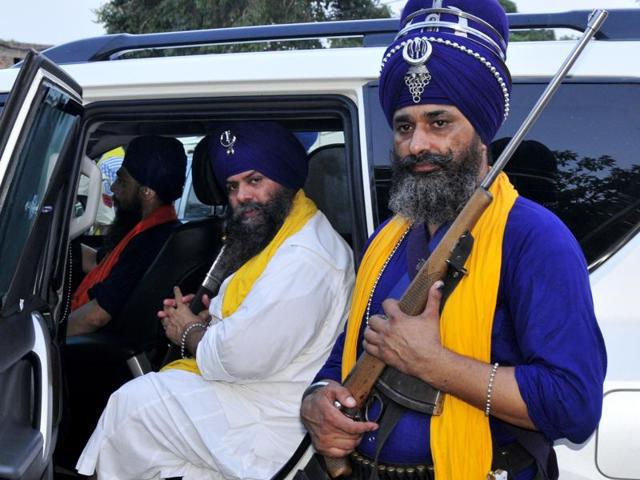 Flanked by private guards, Budha Dal head Balbir Singh in his bullet-proof car. (Ravi Kumar/HT Photo) Flanked by private guards, Budha Dal head Balbir Singh in his bullet-proof car. (Ravi Kumar/HT Photo)