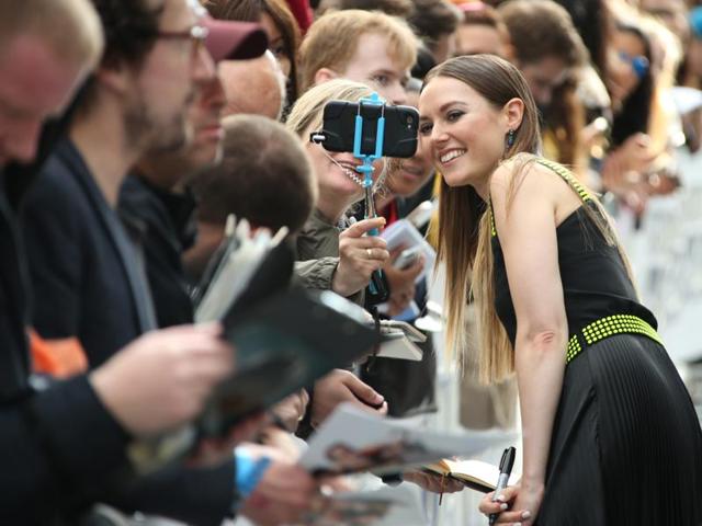 Actor Lydia Wilson poses for a selfie with a fan at the red carpet premiere of the Star Trek Beyond in London. (Joel Ryan/Invision/AP) 