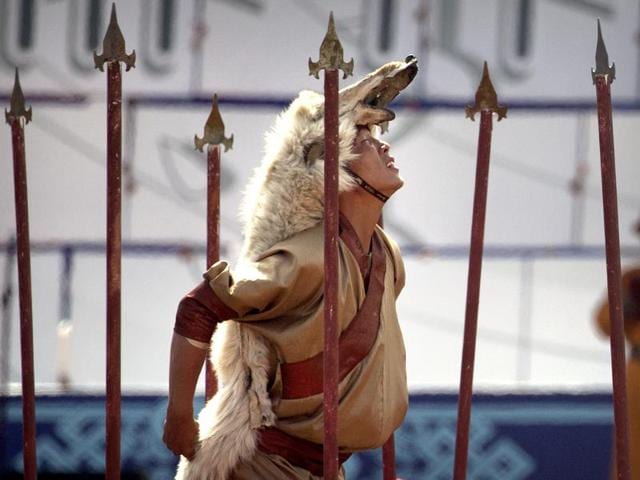 A performer wearing a wolfskin strikes a pose. (AP) A performer wearing a wolfskin strikes a pose. (AP)