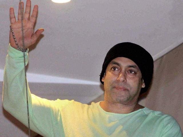 Bollywood actor Salman Khan waves to his fans during Eid al-Fitr celebrations in Mumbai.(PTI Photo)