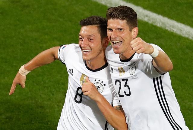Germany's Mesut Ozil, celebrates with his teammate Mario Gomez after scoring his side's first goal. (AP Photo) Germany's Mesut Ozil, celebrates with his teammate Mario Gomez after scoring his side's first goal. (AP Photo)